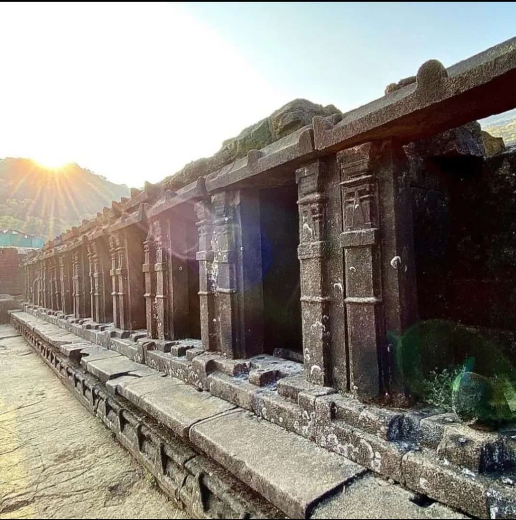 Saptatirtha water tank stone pillars in bright sun